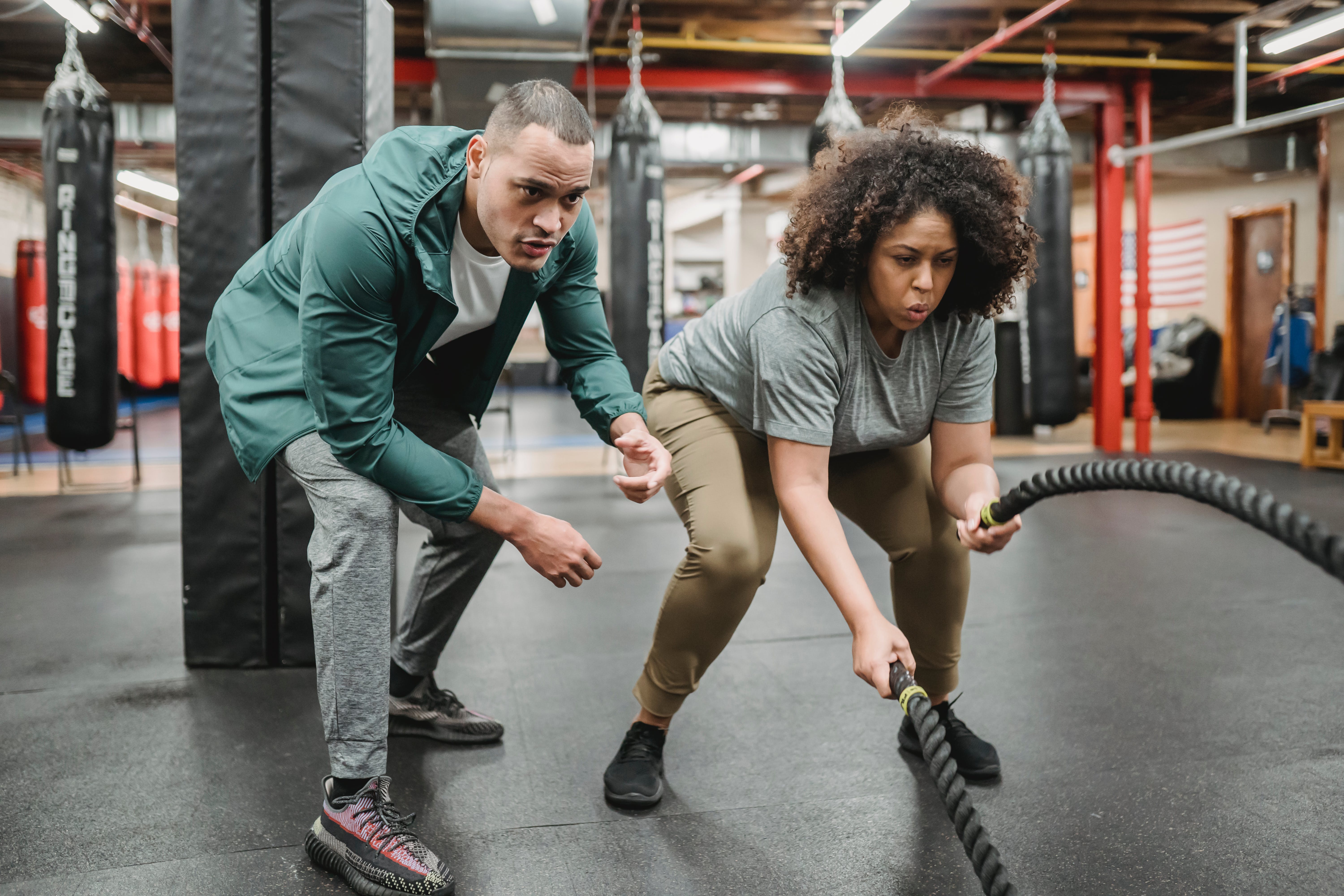 Woman working out with personal trainer